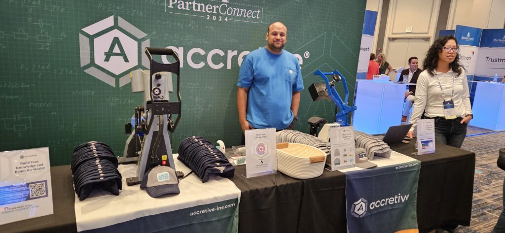 live heat press hat bar setup for accretive expo booth