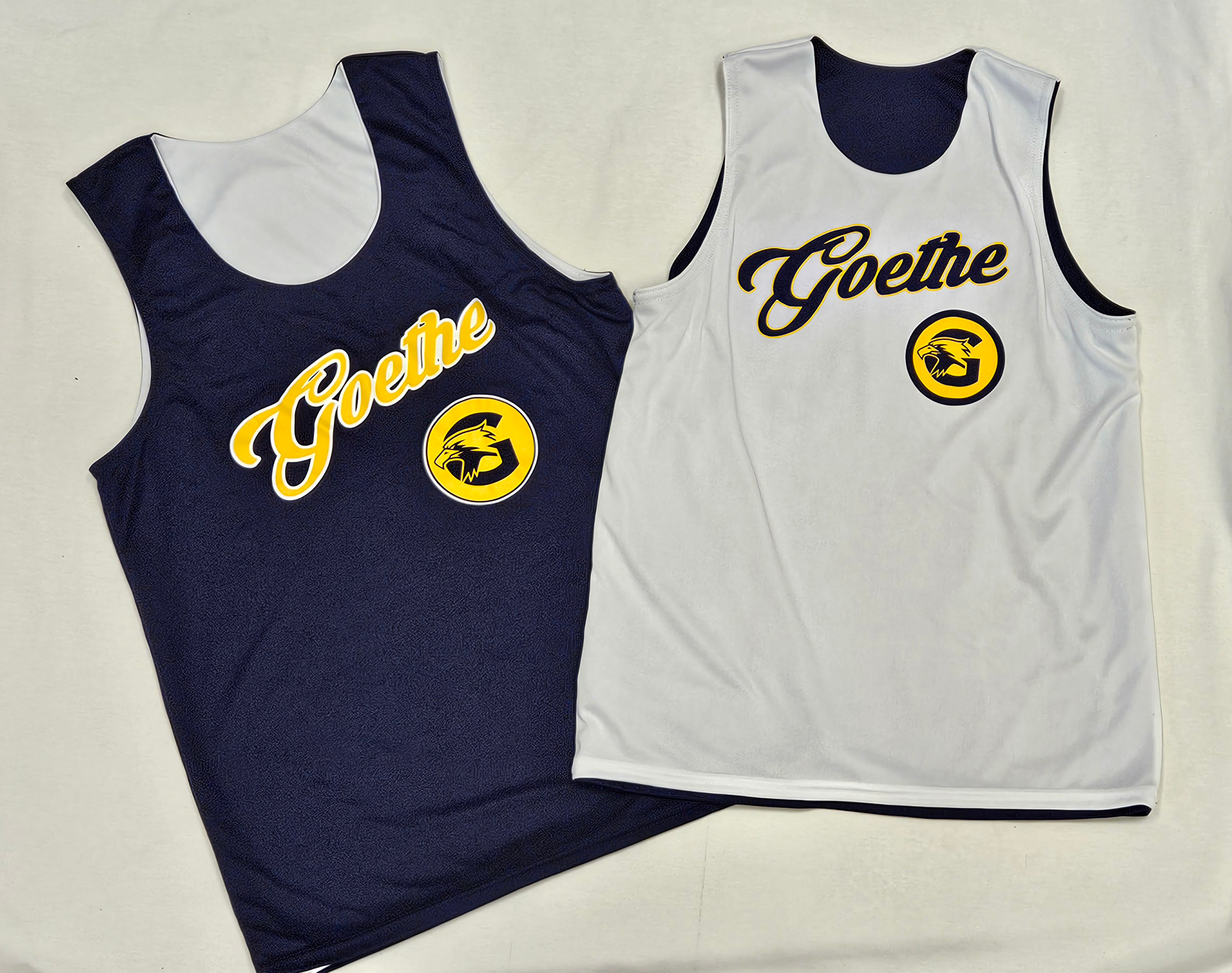 side by side image of navy and white sides of the reversible customized basketball jersey