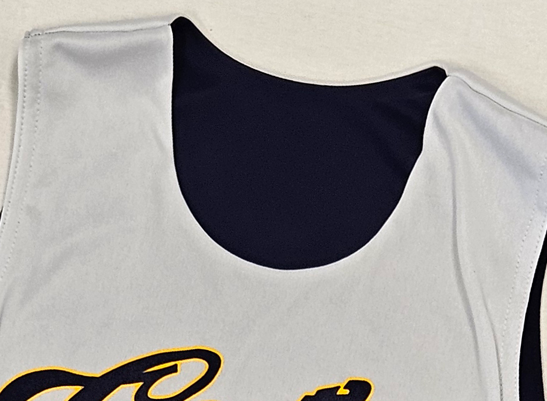 close up of scoop neck jersey seams 