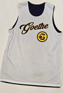 white side of reversible basketball jersey with open bottom hem visible