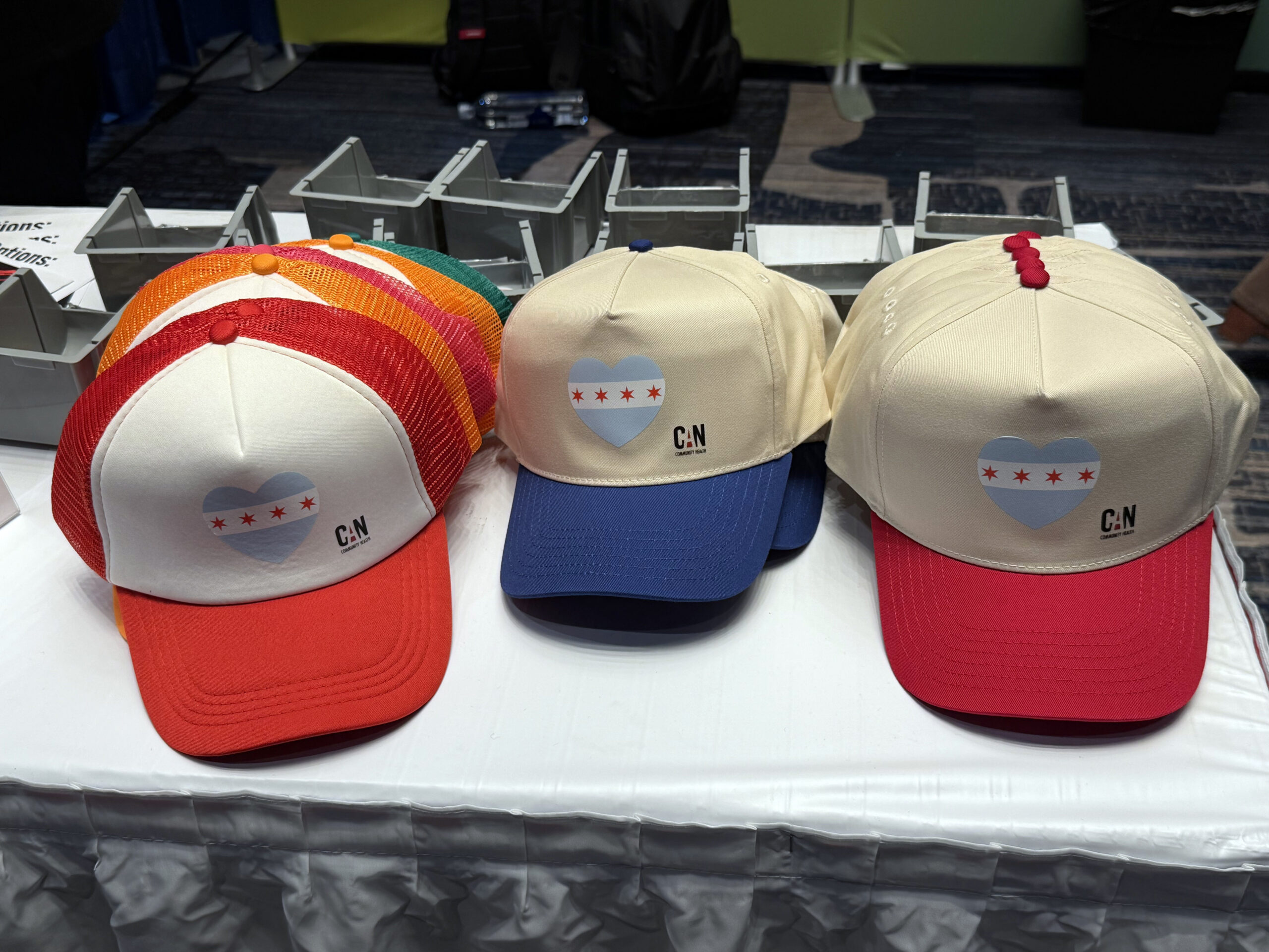 Front view of trucker hats with prepress chicago flag art featuring CANN logo