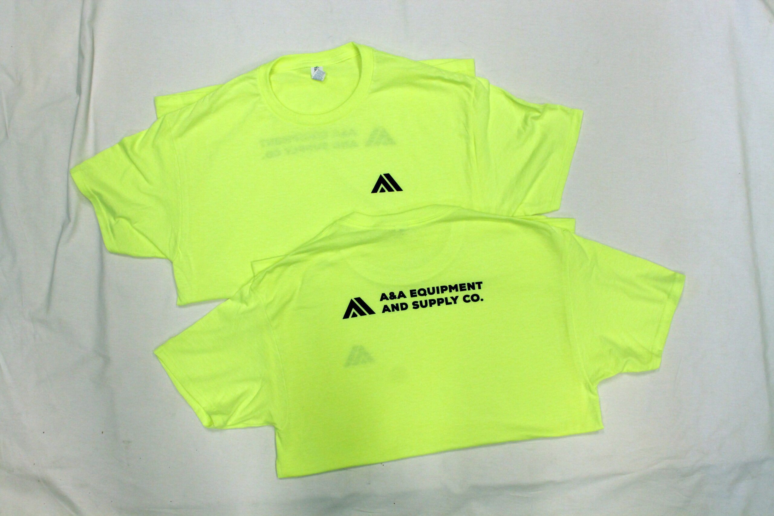 Safety Green construction apparel with single color logo on the front left chest and full back