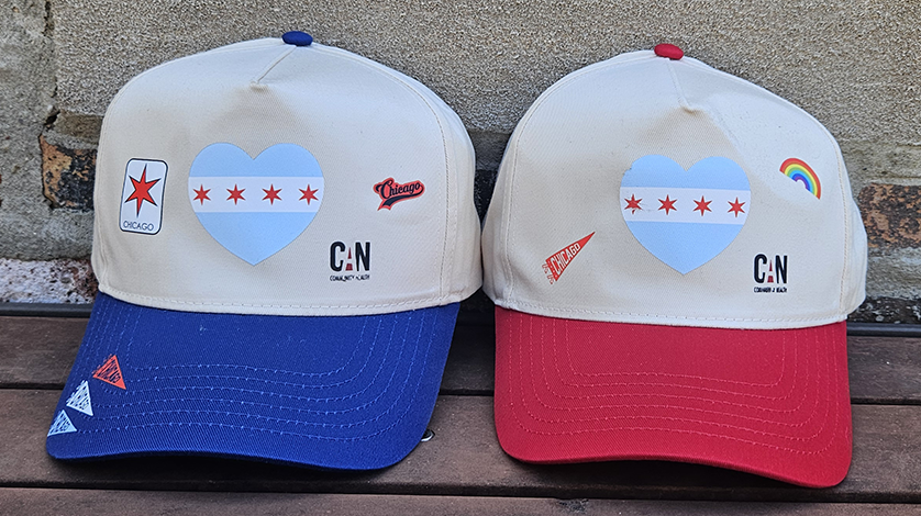 side by side of red and blue CANN Hats with decoration options
